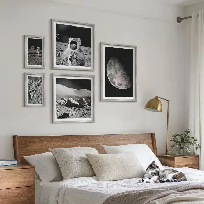 Gallery wall featuring astronaut lunar landscapes