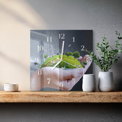 Glass clock square Earth in the hand