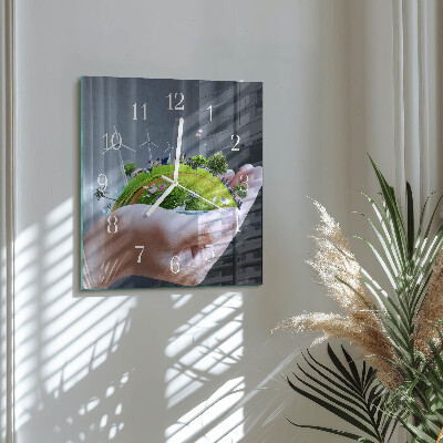 Glass clock square Earth in the hand